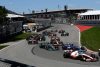 CIRCUIT GILLES-VILLENEUVE, CANADA - JUNE 19: Mick Schumacher, Haas VF-22, leads Esteban Ocon, Alpine A522, George Russell, Mercedes W13, Daniel Ricciardo, McLaren MCL36, and the remainder of the field at the start during the Canadian GP at Circuit Gilles-Villeneuve on Sunday June 19, 2022 in Montreal, Canada. (Photo by Mark Sutton / LAT Images)